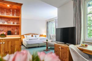 TV a/nebo společenská místnost v ubytování Hotel Freisinger Hof