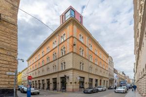 a building with a clock tower on top of it at Paulay at Opera Suites P39 in Budapest