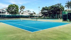 a tennis court with a tennis racket on it at Spacious 2BR condo on Siesta Key with private beach access in Siesta Key