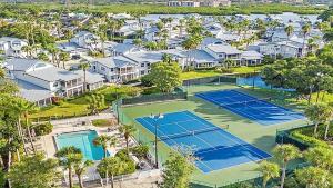 an aerial view of two tennis courts in a villa at Beach Access - Tennis - Two Pools - Fishing Dock in Siesta Key