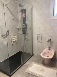 a bathroom with a shower and a toilet at Maison provençale de Plain pied avecGrand jardin et Piscine in Aubagne +10 photos