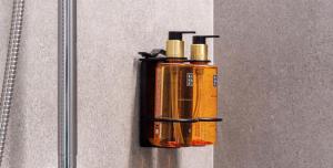 an orange fire extinguisher hanging on a wall at Osito Hub - Duque de Gaeta in Valencia