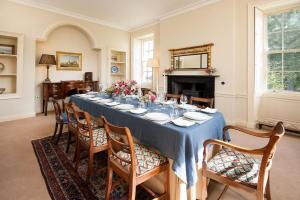 a dining room with a long table and chairs at East House in Berwick-Upon-Tweed +37 photos