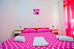 Postel nebo postele na pokoji v ubytování Apartments Alać