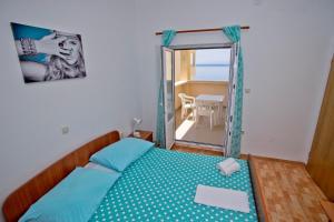 Postel nebo postele na pokoji v ubytování Apartments Alać
