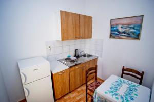 Kuchyň nebo kuchyňský kout v ubytování Apartments Alać