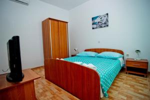 Postel nebo postele na pokoji v ubytování Apartments Alać