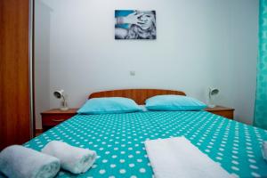 Postel nebo postele na pokoji v ubytování Apartments Alać