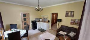 a living room with a couch and a table at Vila Kost Apartman 2 in Libošovice