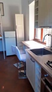 a kitchen with a sink and a counter top at Palma House in La Massimina-Casal Lumbroso