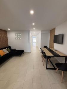 a living room with a table and a couch at Angel 29 in Vinarós