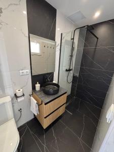 a bathroom with a sink and a shower at Angel 29 in Vinarós +24 photos