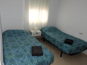 A seating area at Glauka Apartamento tranquilo con Aire Acondicionado