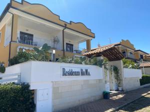 a building with a sign that reads redeemer villa at Residenza RoMa in Tropea