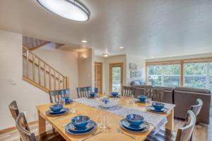 a dining room with a table and chairs at Seas the Day in Shorepine in Pacific City