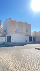 an empty street in front of a building at RoseVilla روزفيلا in Ḩaql +26 photos