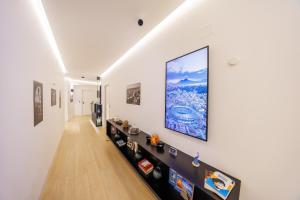 a hallway with a large painting on the wall at Arya Guest House in Naples