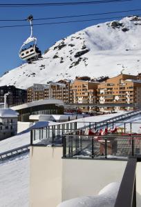 a ski resort in the snow with a ski lift at Hôtel Val Chavière in Val Thorens +43 photos
