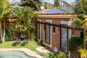 a resort with a swimming pool and a building at Rambla de Marisol Apartments in Castelldefels