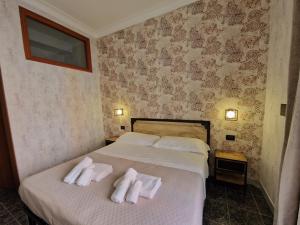 Postel nebo postele na pokoji v ubytování Hotel Agorà