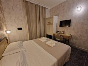 Postel nebo postele na pokoji v ubytování Hotel Agorà