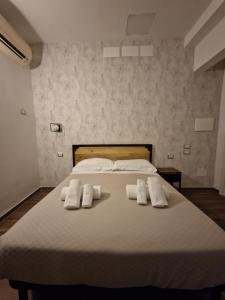 Postel nebo postele na pokoji v ubytování Hotel Agorà
