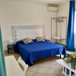 Postel nebo postele na pokoji v ubytování Dépendance in Villa Siciliana