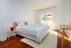Ένα ή περισσότερα κρεβάτια σε δωμάτιο στο Altea Alicante, amplio Duplex en Isla de Altea +18 φωτογραφίες