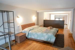 Ένα ή περισσότερα κρεβάτια σε δωμάτιο στο Chimbe - Loft moderno a un passo da tutto