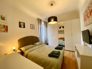 a bedroom with a bed and a television in it at Casa Lorenz in Florence