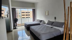 Aparta-Suite Dúplex de Lujo客房内的一张或多张床位