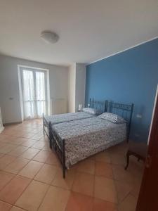 Ένα ή περισσότερα κρεβάτια σε δωμάτιο στο La casa di Stina