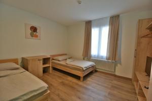 Postel nebo postele na pokoji v ubytování Hotel Waldegg Zuchwil + 14 fotografií