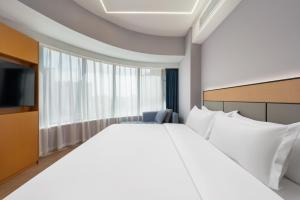 Fotografie z fotogalerie ubytování 沃德Smart酒店济南东站店 v destinaci Ťi-nan