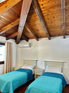 Postel nebo postele na pokoji v ubytování Villa LUMIè Stintino
