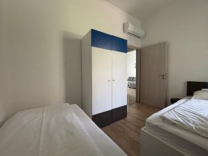 Posteľ alebo postele v izbe v ubytovaní Aranyhíd Deluxe Apartman