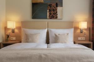 Postel nebo postele na pokoji v ubytování Garner Hotel Hamburg - Wandsbek Marktplatz by IHG