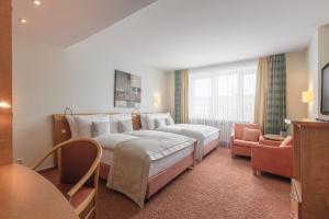 Postel nebo postele na pokoji v ubytování Garner Hotel Hamburg - Wandsbek Marktplatz by IHG
