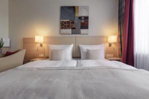 Postel nebo postele na pokoji v ubytování Garner Hotel Hamburg - Wandsbek Marktplatz by IHG