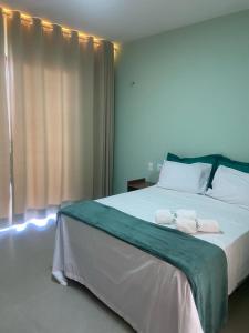 Postel nebo postele na pokoji v ubytování Condomínio Aliete Mendes