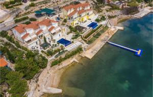 an aerial view of a house in the water at Nice Apartment In Vidalici in Kustići