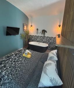 a bathroom with a bath tub and a sink at Blue Zen - Relaxing loft a Porta Nuova in Turin