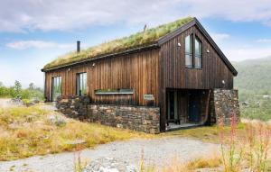 a house with a grass roof on a hill at 2 Bedroom Cozy Home In Edland in Vågsli