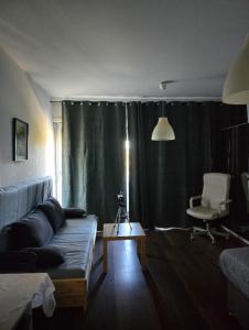 a living room with a couch and a chair at Chic Central Stay in Luxembourg in Luxembourg +19 photos