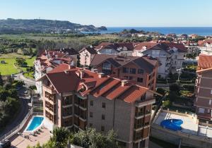 an aerial view of a city with buildings and the ocean at Apartamentos Boutique Don Miguel in Noja