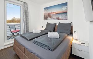Ένα ή περισσότερα κρεβάτια σε δωμάτιο στο Haus Seeblick Am Deich