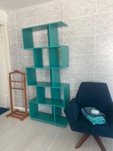 Et opholdsområde på Suíte com entrada independente Pelotas