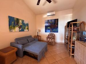 a living room with a couch and a chair at Melrose Suite in San Juan del Sur