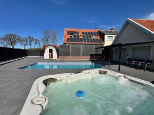a swimming pool in the middle of a house at Ferienwohnung Neubörger mit Wellness in Neubörger