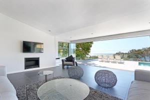 a living room with a view of the ocean at Valtameri by Totalstay in Cape Town